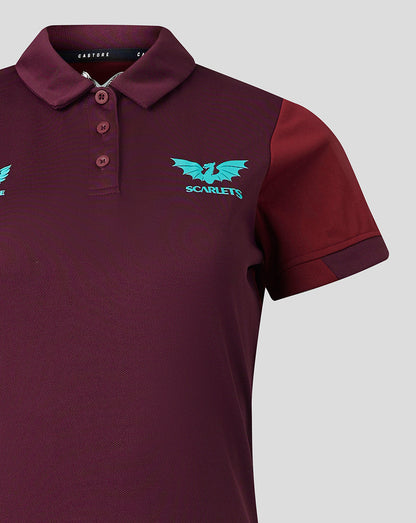 Close-up of burgundy Scarlets travel polo showing collar, three-button placket and turquoise crest on the left chest.