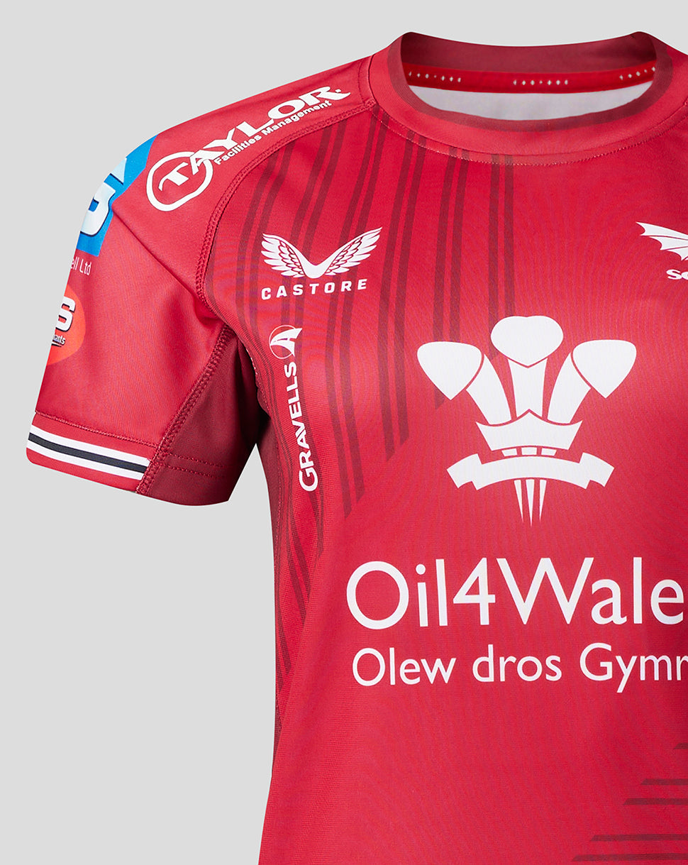 Back view of Scarlets Women’s 23/24 home shirt with ASCONA and Dyfed Steels logos on a red striped jersey