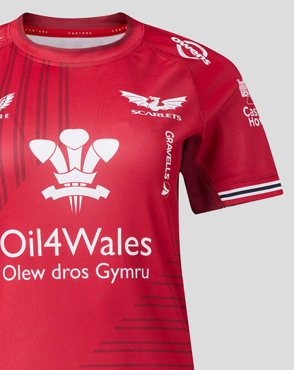 Scarlets Women’s 23/24 home shirt front with Oil4Wales sponsor, Scarlets crest left chest and Castore branding on red striped fabric