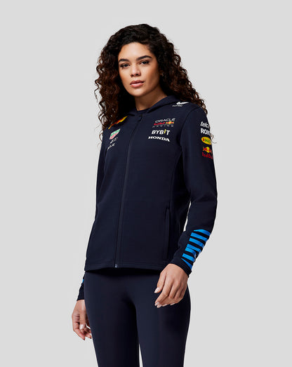 Woman wearing a navy full zip hoodie featuring Oracle Red Bull Racing logos and back graphic