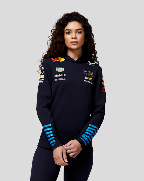 Model wearing navy Night Sky Hoodie with Oracle Red Bull Racing branding on chest and sleeves.
