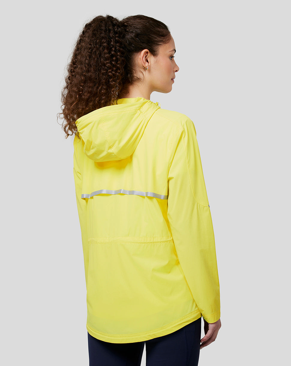 Back view of the bright yellow windbreaker showing a hood and a reflective band across the back