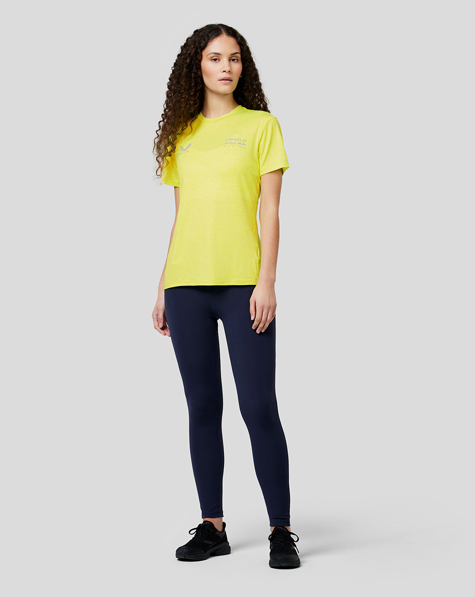 Front view of a model wearing Safety Yellow Oracle Red Bull Racing women's active dual brand tee