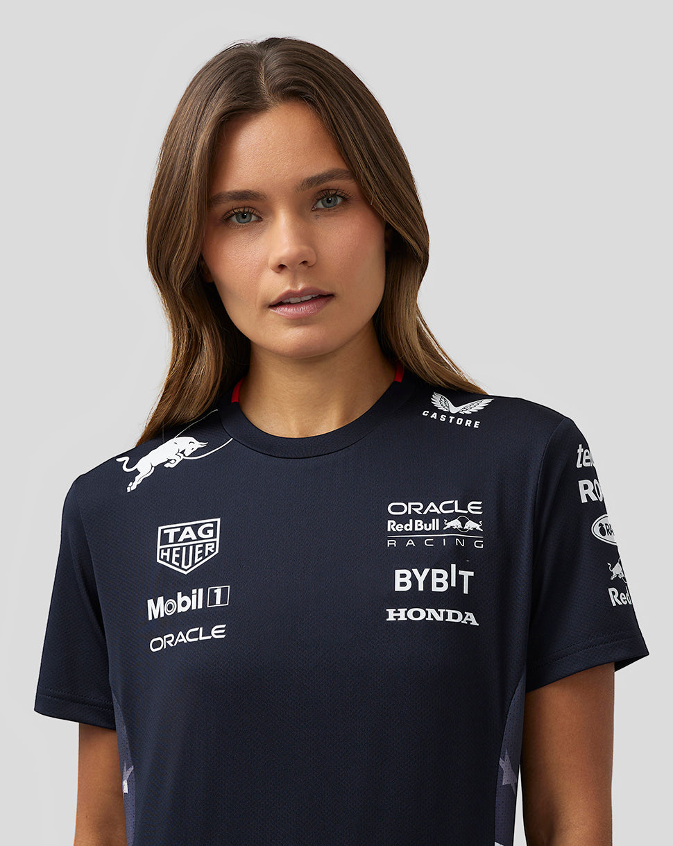 Woman wearing navy Night Sky Oracle Red Bull Racing America Race Team T Shirt with sponsor logos on chest and sleeves