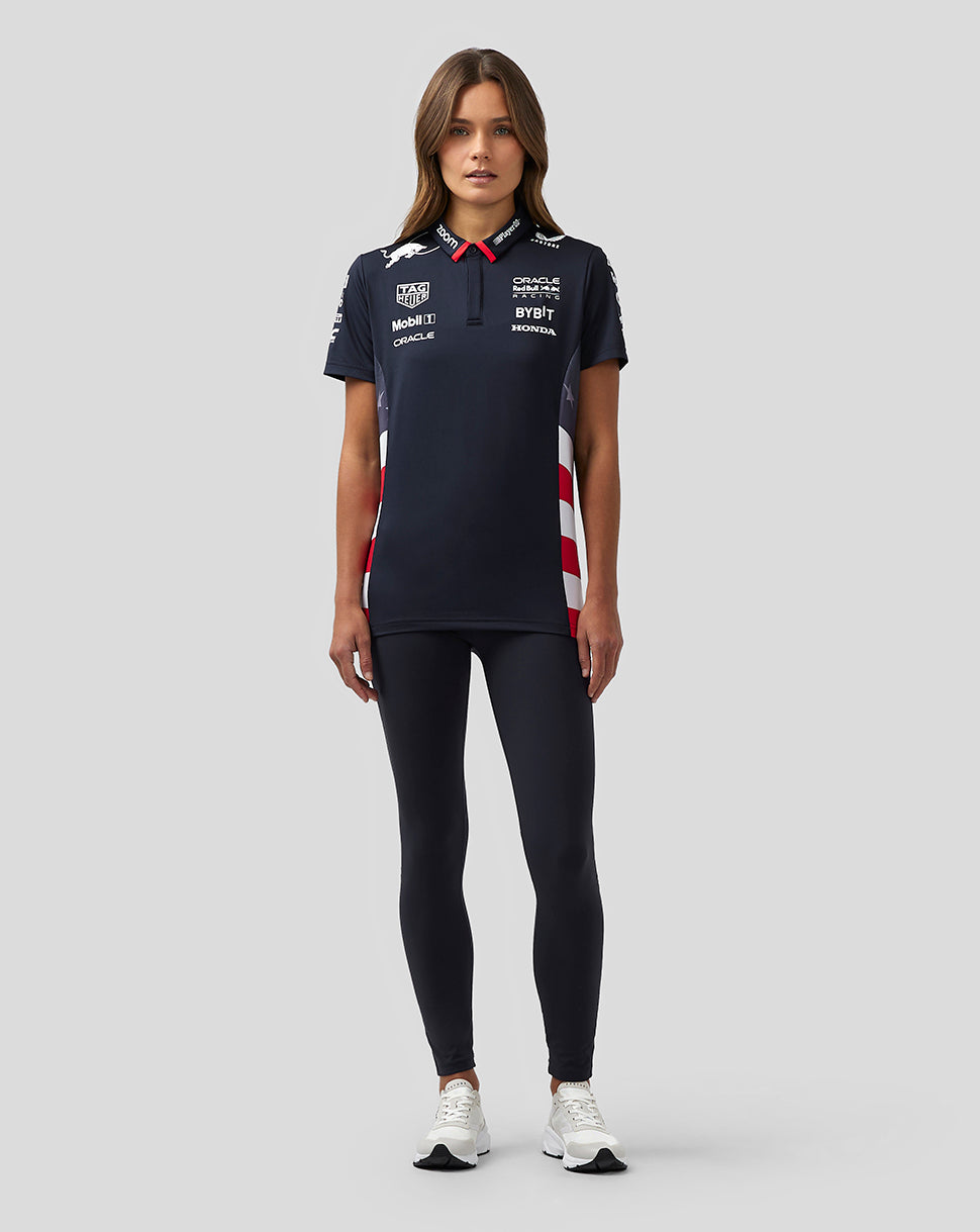 Model wearing navy Oracle Red Bull Racing Women’s America Race Team Polo with sponsor logos