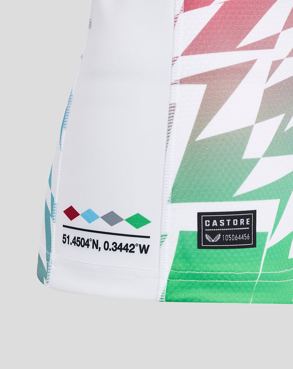Close up of Harlequins Away Pro Shirt hem showing coordinates and colorful diamond print with Castore branding.