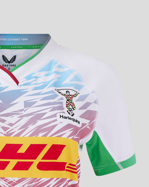 Close up of Harlequins Women away shirt showing crest on chest and vivid multicolor graphic