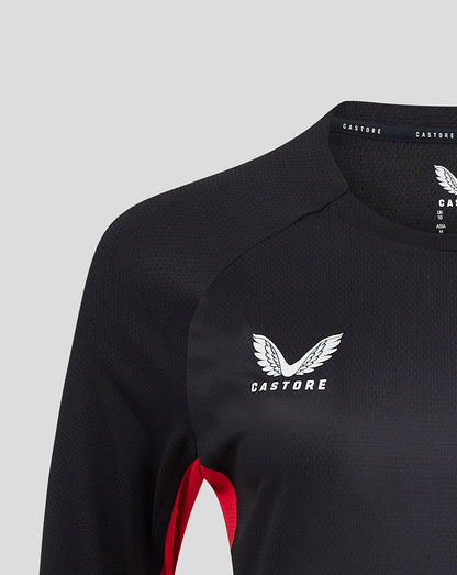 Close-up of black 24/25 matchday long sleeve tee with white wing crest and Castore branding at the neckline.