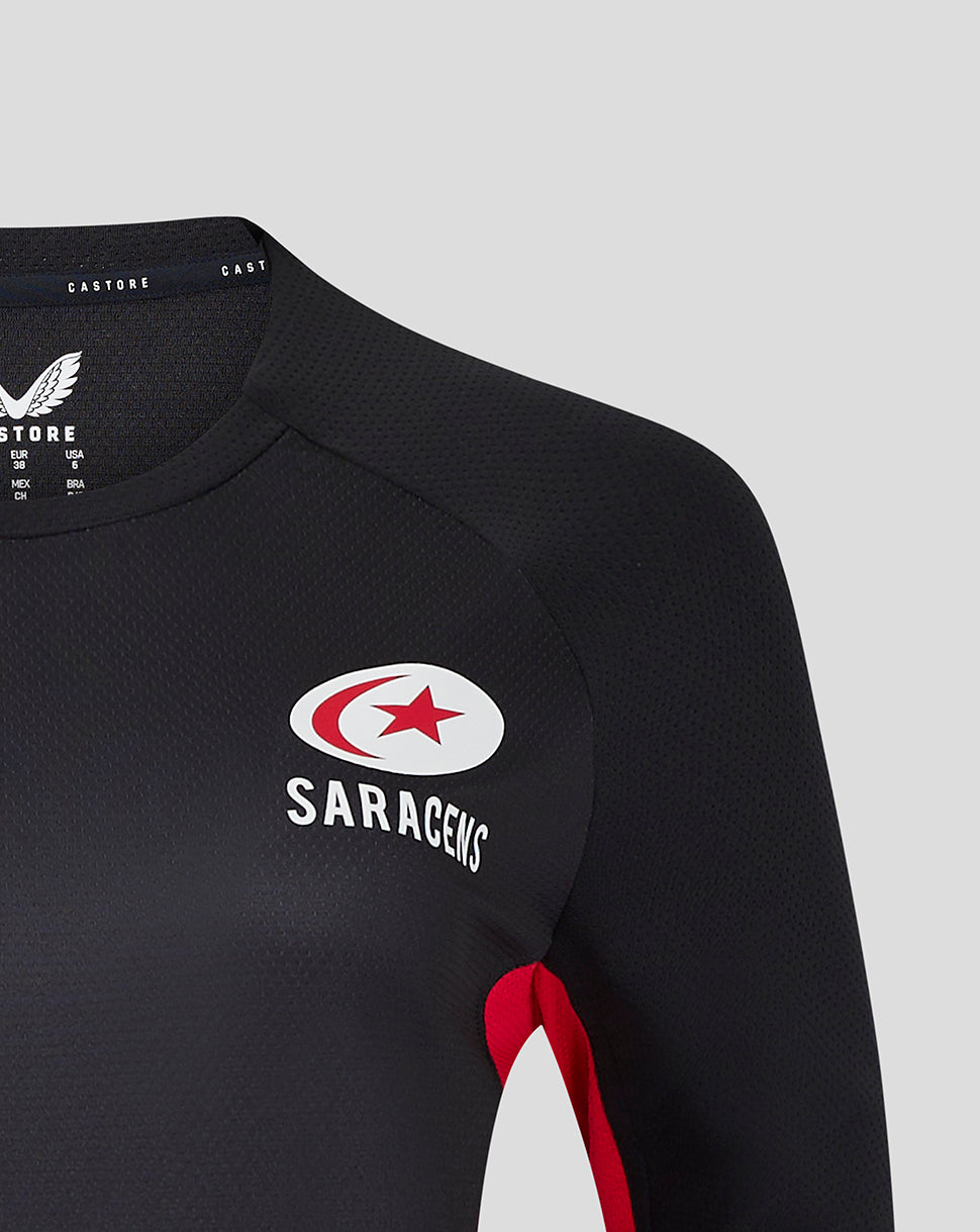 Midsection of black 24/25 matchday long sleeve tee revealing crest and red white stripes across the chest.