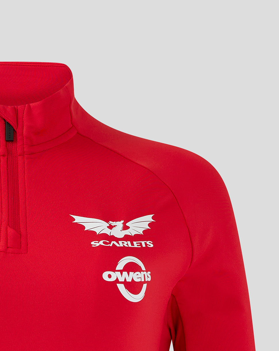 Close up of red Scarlets midlayer chest with Castore logo on left, Scarlets crest and Owens sponsor on right chest