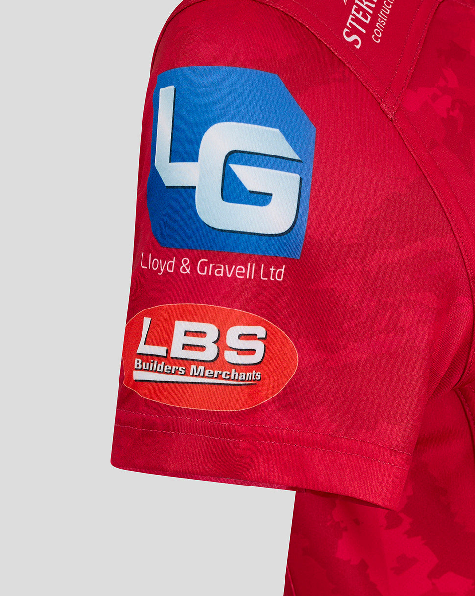 Close view of the Scarlets home shirt sleeve hem with LBS Builders Merchants logo