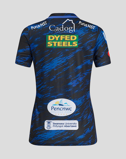 Back view of Scarlets Women's Away Shirt in dark blue camo with Dyfed Steels logo centered on the back and additional sponsor logos along the lower back.