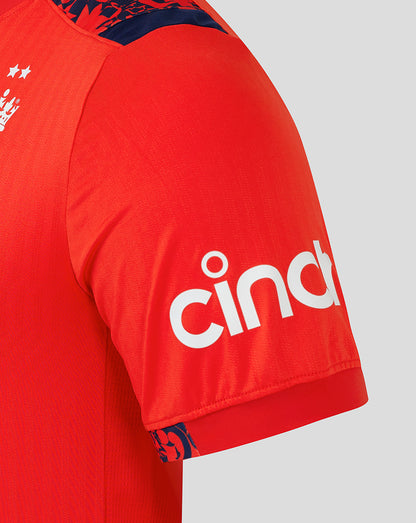 Shoulder and sleeve close-up of the red England shirt, featuring navy patterned trim along the shoulder.