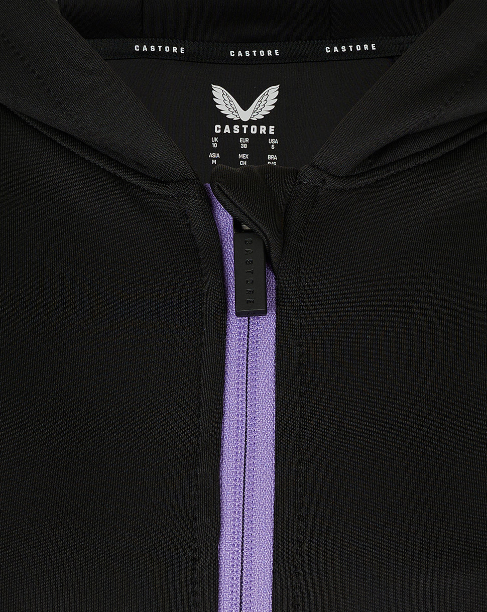 Inside neck label with Castore branding and size chart for the England Women training hoodie