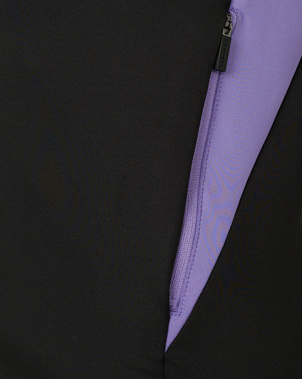 Close up of black training hoodie zipper with purple tape and purple side panel along the sleeve