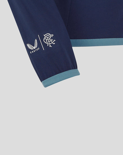 Close-up of Rangers FC travel jacket sleeve with Castore logo and club crest