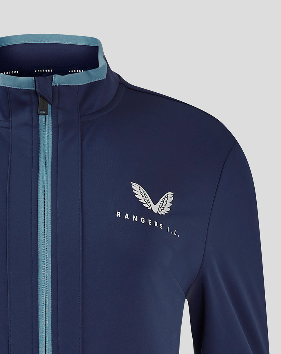 Close up of navy Rangers travel jacket chest showing the white club crest and light blue collar trim