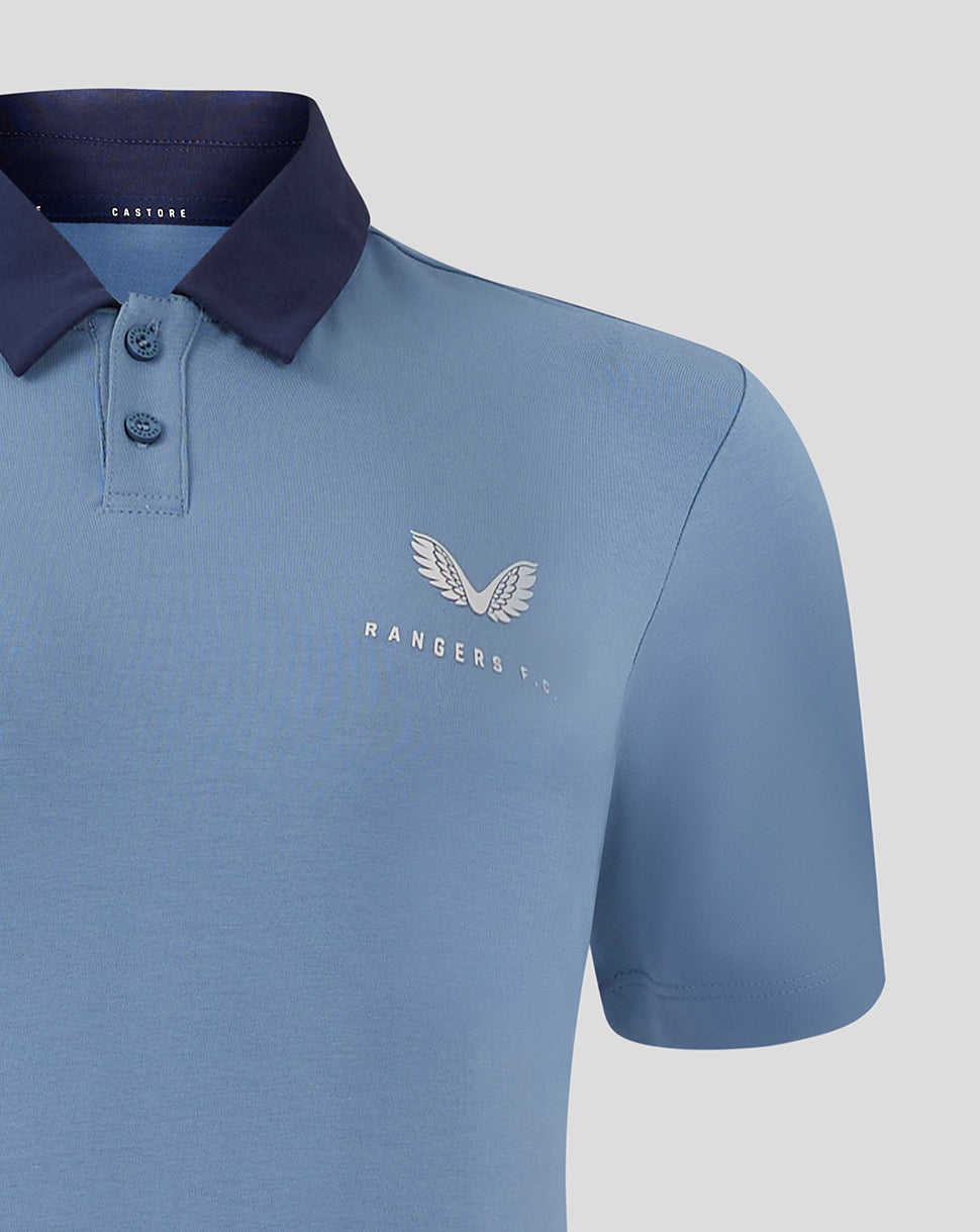 Light blue Rangers FC travel polo close up of left chest logo and navy collar with two button placket