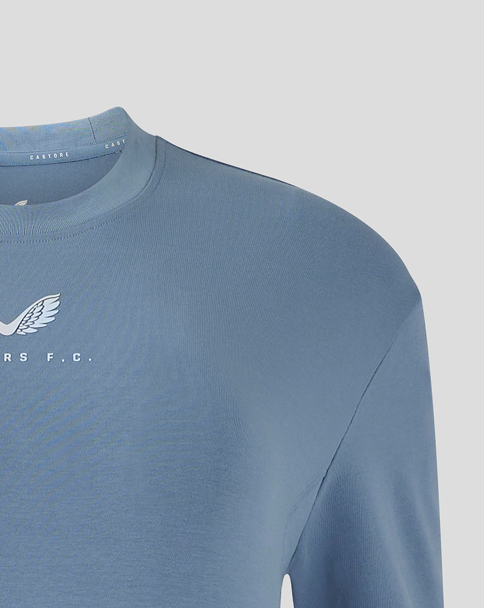 Close up of shoulder and neckline of light blue Rangers travel T shirt with ribbed crew neck and Castore branding visible