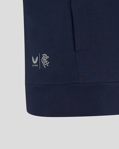 Close-up of navy Rangers travel hoody hem showing Castore and club branding near the side seam