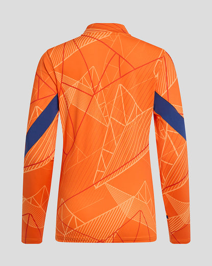 Back view of bright orange Rangers 24/25 women's league matchday midlayer with white geometric print and blue sleeve accents.