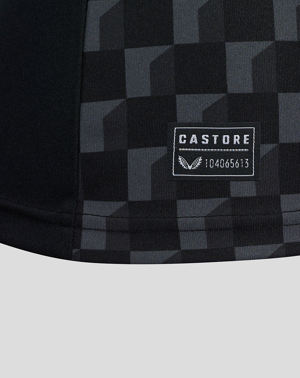 Close-up of Mansfield Third Shirt front showing geometric pattern with left chest crest and Castore on the right chest.