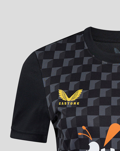 Detail of chest area showing Castore branding on the front against the geometric print.