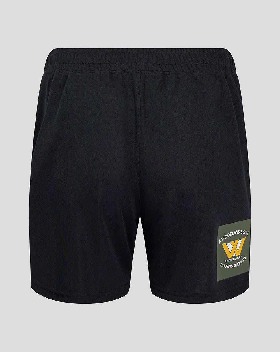 Back view of Mansfield Third Shorts showing a green sponsor patch on the right leg near the hem.