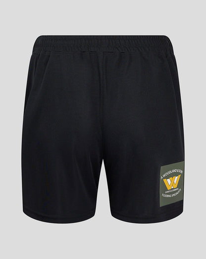 Back view of Mansfield Third Shorts showing a green sponsor patch on the right leg near the hem.
