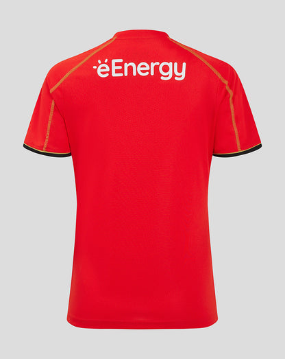 Back view of red Mk Dons women's away shirt with éEnergy logo on upper back and black sleeve trim