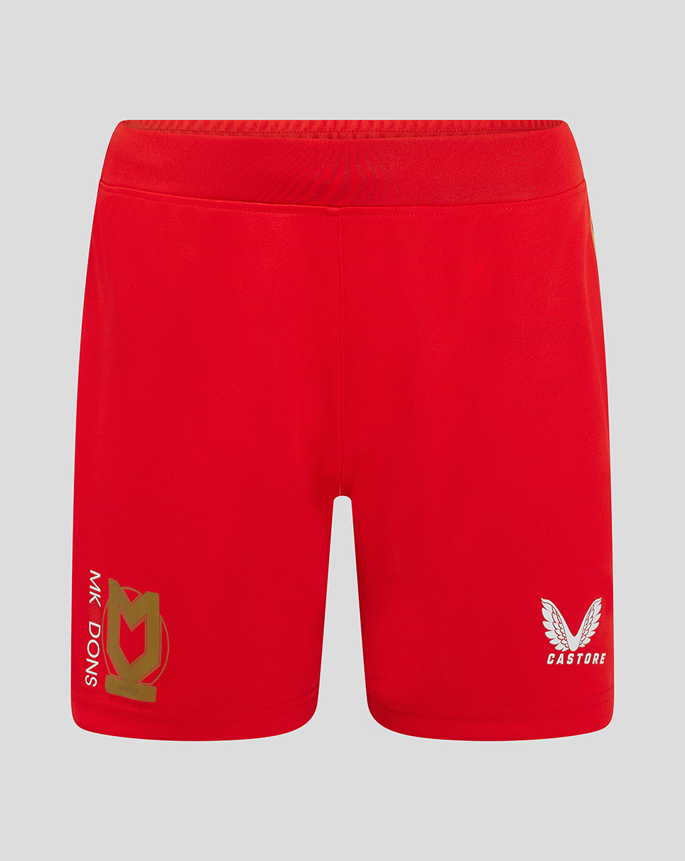 Front view of red Mk Dons women's 24/25 away shorts with crest on left leg and Castore logo on right.