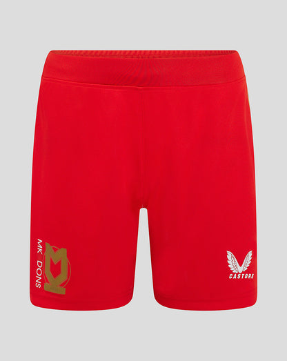Front view of red Mk Dons women's 24/25 away shorts with crest on left leg and Castore logo on right.