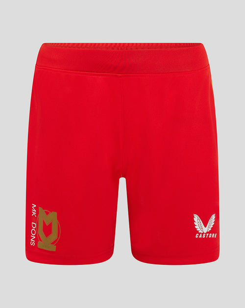Front view of red Mk Dons women's 24/25 away shorts with crest on left leg and Castore logo on right.