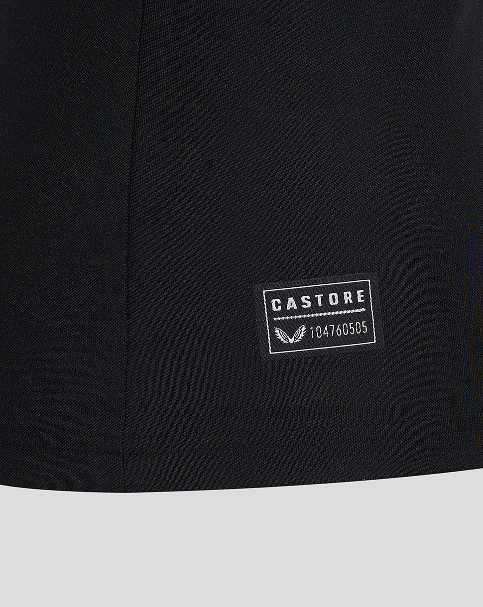 Close-up of black Preston Women's 24/25 Third Shirt fabric with Castore patch near hem.