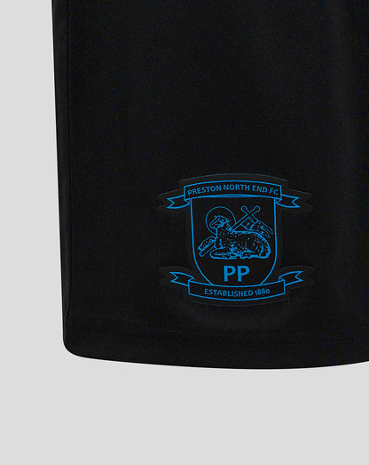 Close-up of black Preston North End third shorts with blue crest on the right thigh.