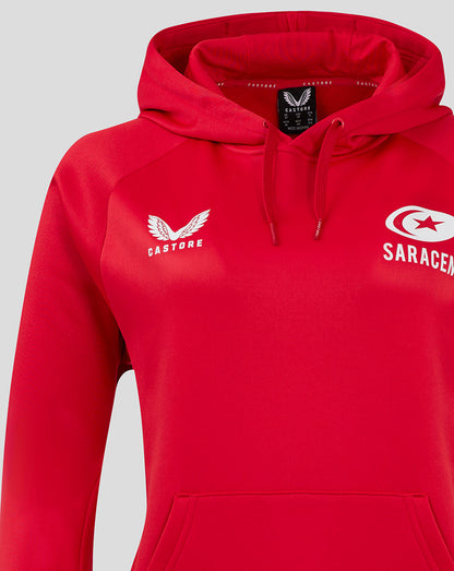 Close-up of red Saracens training hoodie showing Castore logo and Saracens crest.