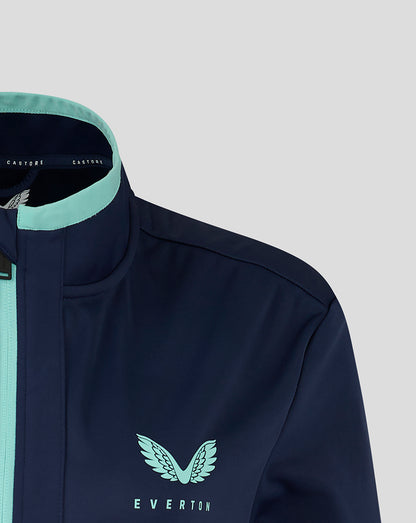 Left chest shows mint wing logo and Everton text on navy travel jacket.