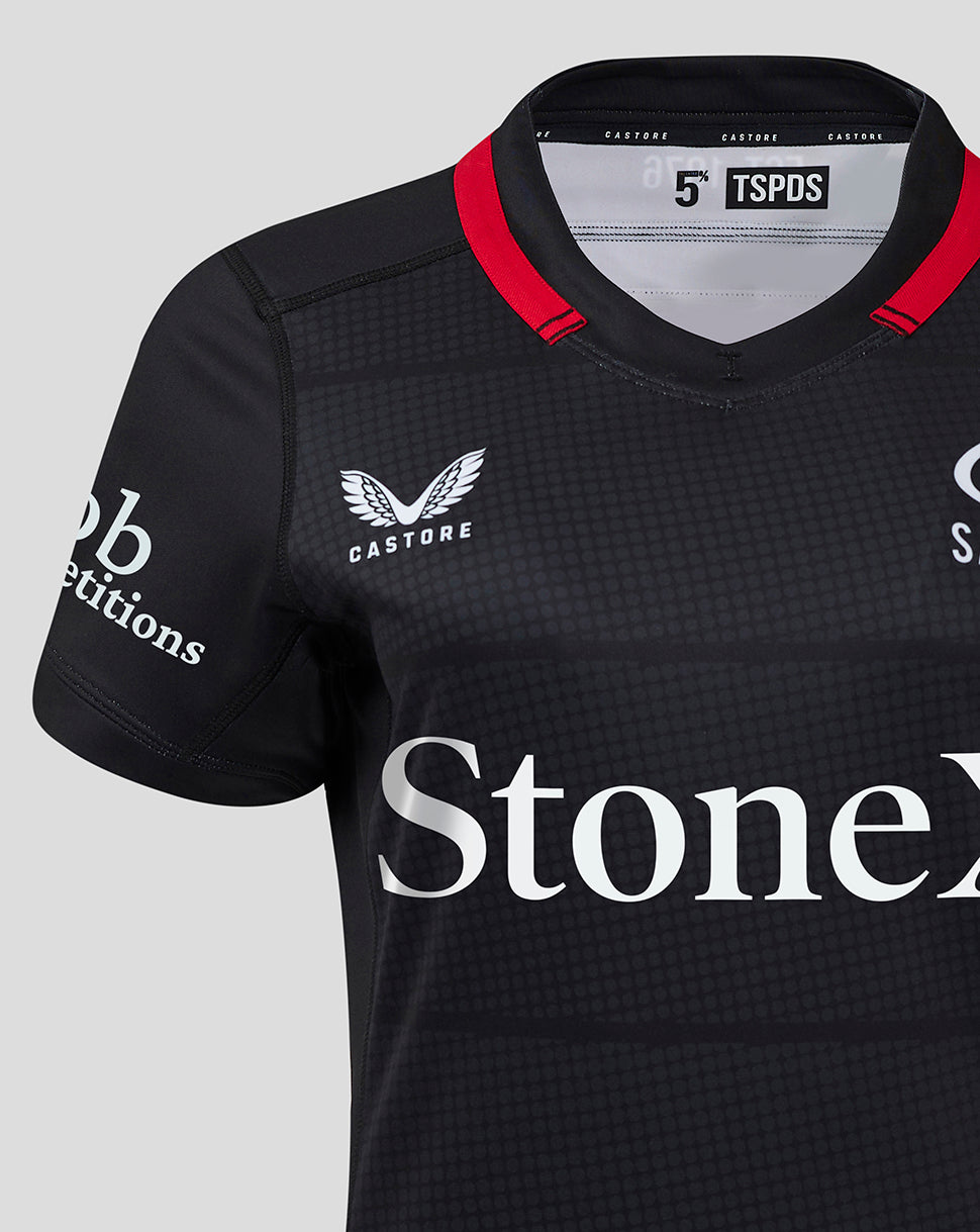 Close up of the chest area showing Castore logo and StoneX sponsor on the Saracens home shirt