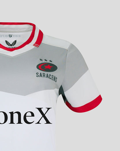 Close-up of Saracens crest on chest of away shirt showing grey panels and red collar details