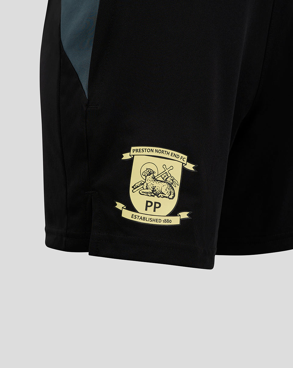 Close up of black Preston shorts showing crest patch near hem and pocket seam