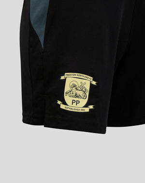 Close up of black Preston shorts showing crest patch near hem and pocket seam