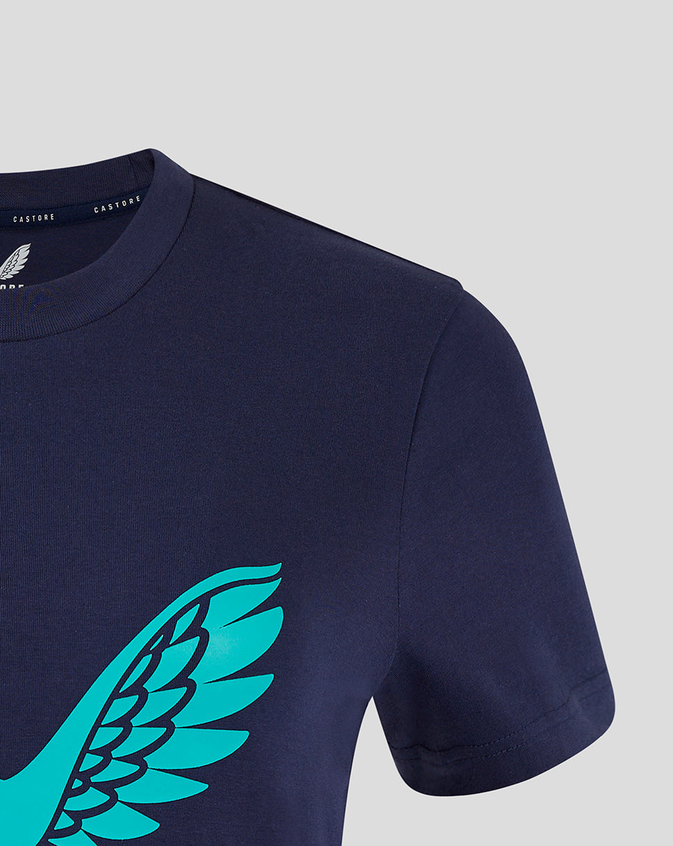 Close-up of turquoise wing logo on navy training tee front with visible shoulder seam.