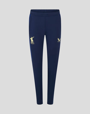Front view of navy Mansfield women's training pants featuring a gold deer MFC logo on the left thigh and a gold winged crest on the right thigh.