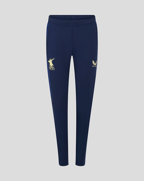 Front view of navy Mansfield women's training pants featuring a gold deer MFC logo on the left thigh and a gold winged crest on the right thigh.
