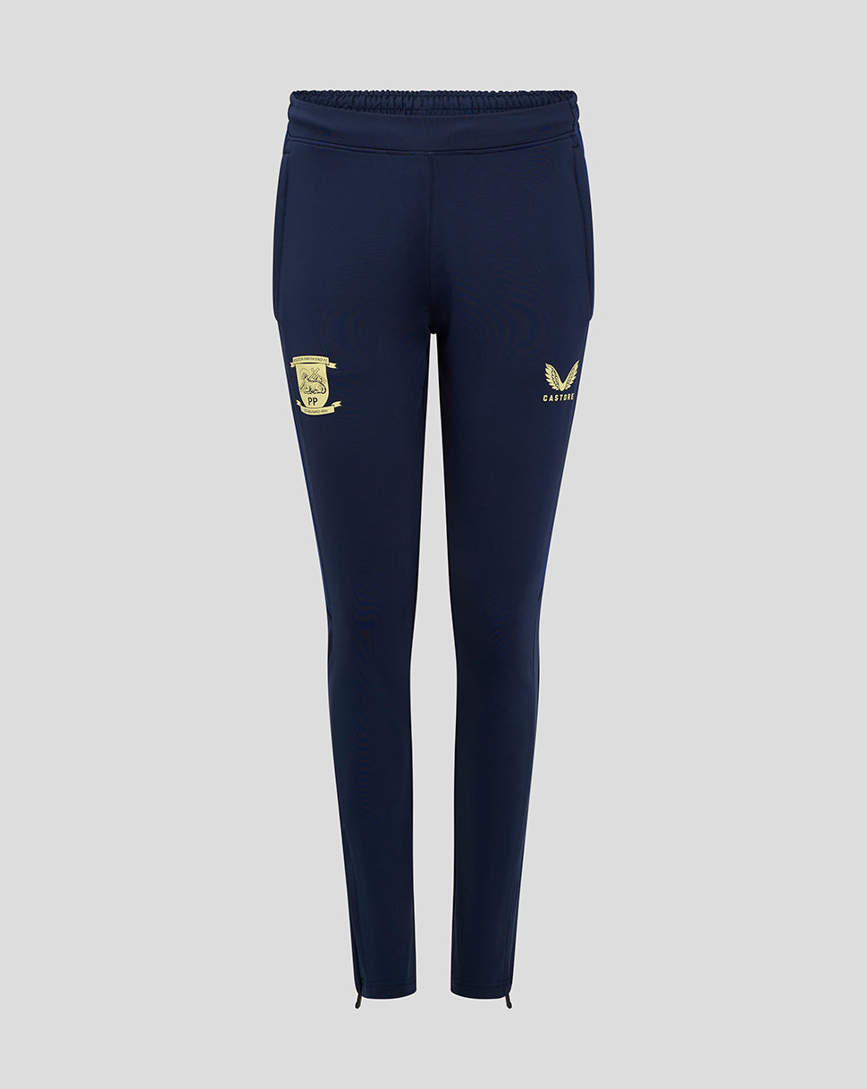 Front view of navy training pants with gold crest on the thigh and Castore logo, ankle zippers.