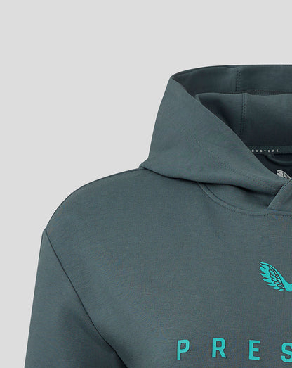 Close-up of Preston NE travel logo hoody chest on teal fabric with turquoise crest and partial Preston text.