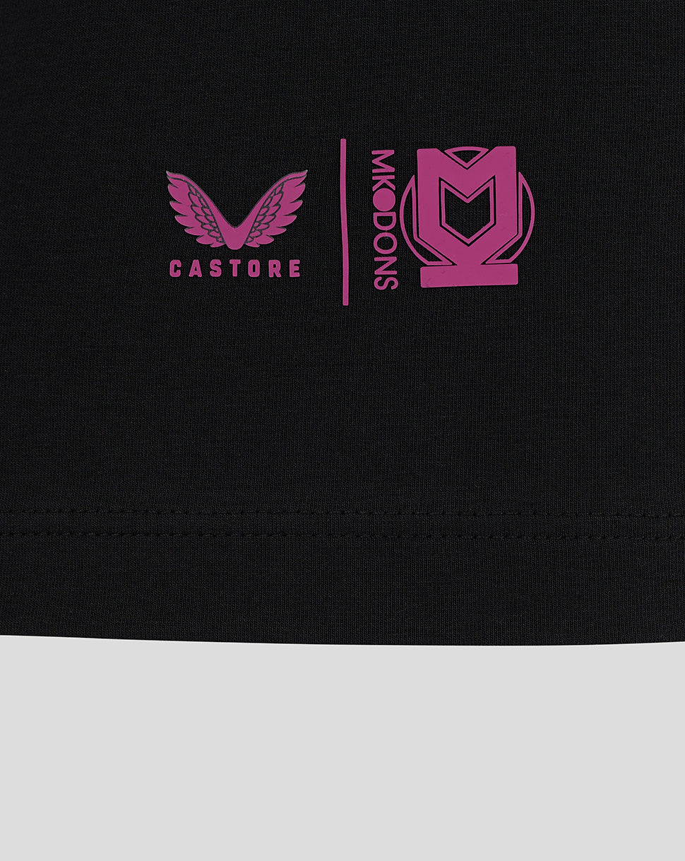 Black Mk Dons travel T shirt close up of chest with pink winged logo and Castore branding