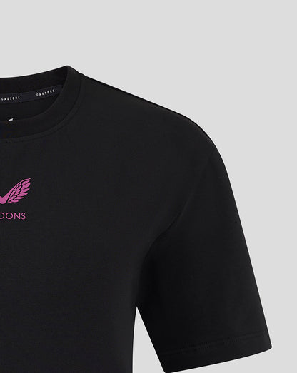 Black Mk Dons travel T shirt shoulder and upper chest with pink Mk Dons logo