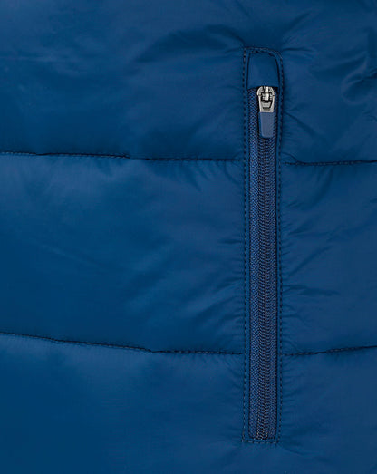 Close up of navy padded gilet zipper detail with vertical zip and stitched panels.