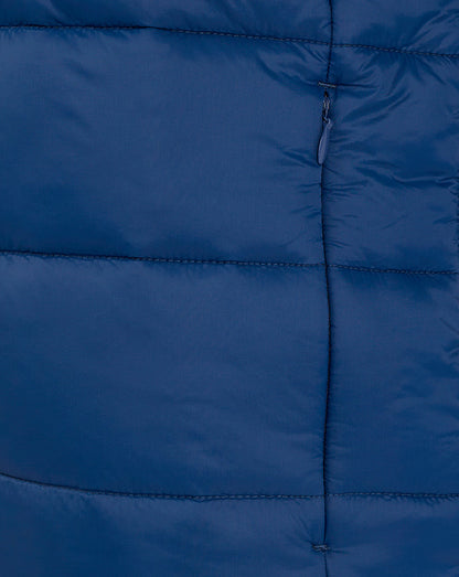Close up of navy puffer jacket front showing vertical zipper and stitched panels